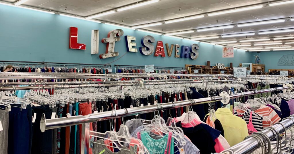 Inside Lifesavers Mission Thrift Store in Auburn, Alabama with racks of clothes. Inside Lifesavers Mission Thrift Store in Auburn, Alabama with racks of clothes.
