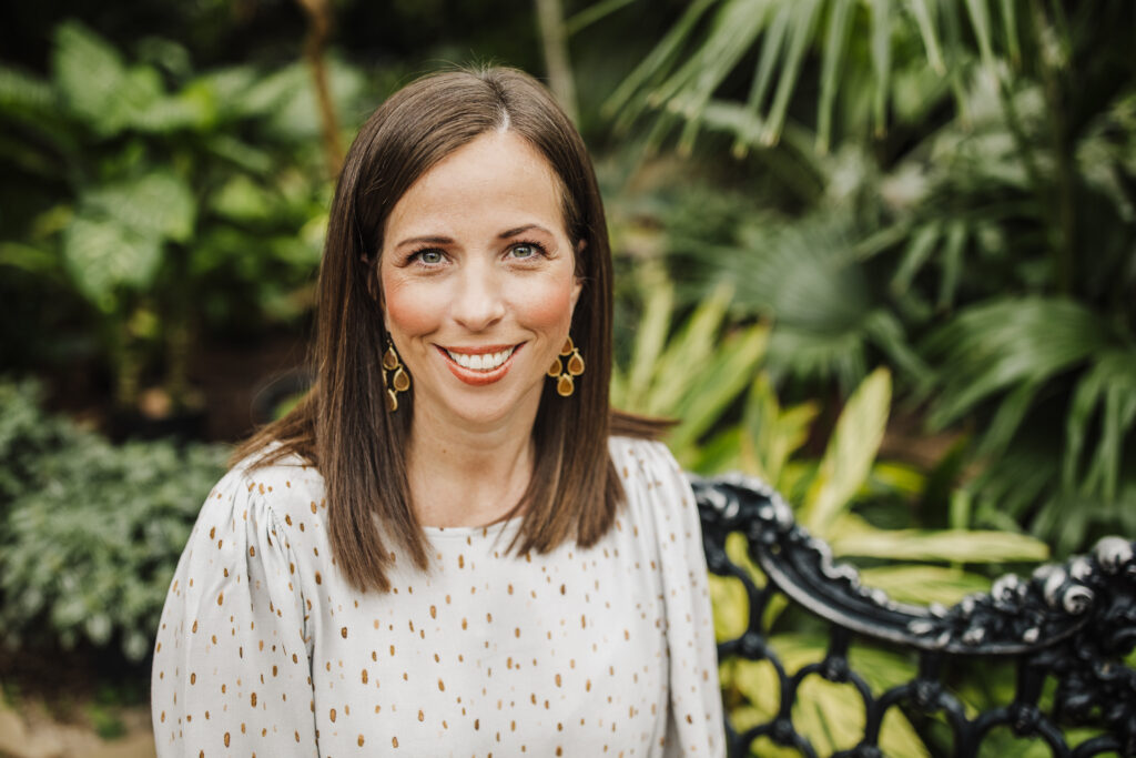 Real Estate Robin Owings Sitting On Bench In Greenery