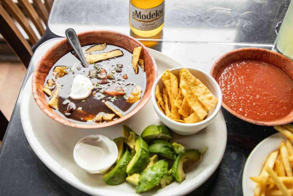 Bamabuzz A Soup With Avacado, Chips And Salsa From La Zona Rosa.