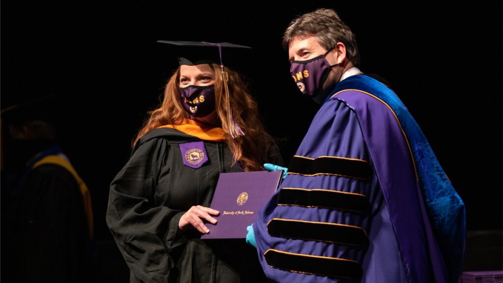 Uncategorized Woman Getting A Diploma At Una