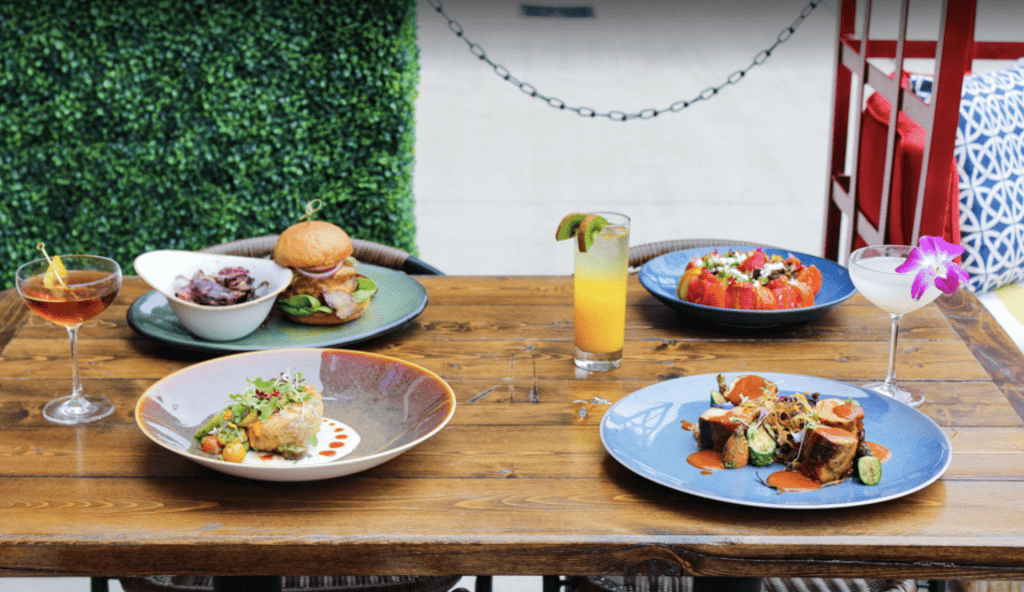 Bamabuzz, Fun, Outdoors Purveyor'S Spread Of Entrées And Drinks Out On The Patio.