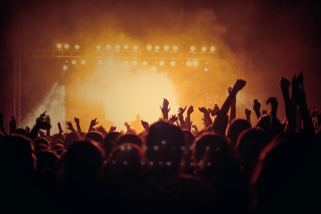Uncategorized Band Performing On Stage In Front Of People