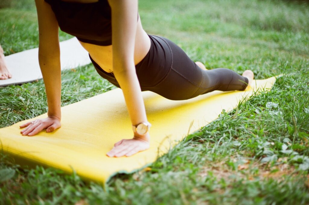 Guide to 5 of Huntsville's best outdoor events for September 3 outdoor events; woman in black shorts and black stockings lying on yellow surfboard