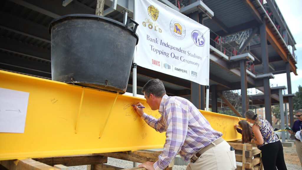 UNA celebrates “topping out” for new multi-purpose stadium