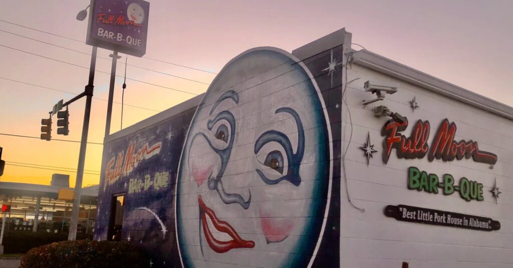 Full Moon is one of the country's legendary BBQ spots 1 Mural of smiling full moon on restaurant