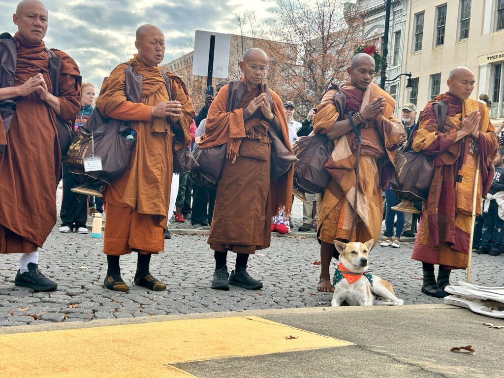 PHOTOS: Walk for Peace monks make extended stop in Montgomery 6 Monks and a dog at gathering.